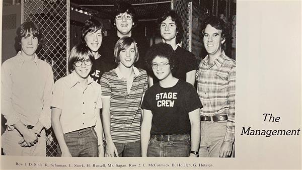 Yearbook photo of several students and Bob Sagan